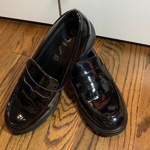 Women’s  Unisa Patent black Loafer size 71/2. Small scuff on left front shoe.